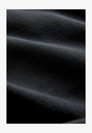 Next, REGULAR FIT - ACTIVE TRAINING DIVISION SHORTS . - Jogginghose - black