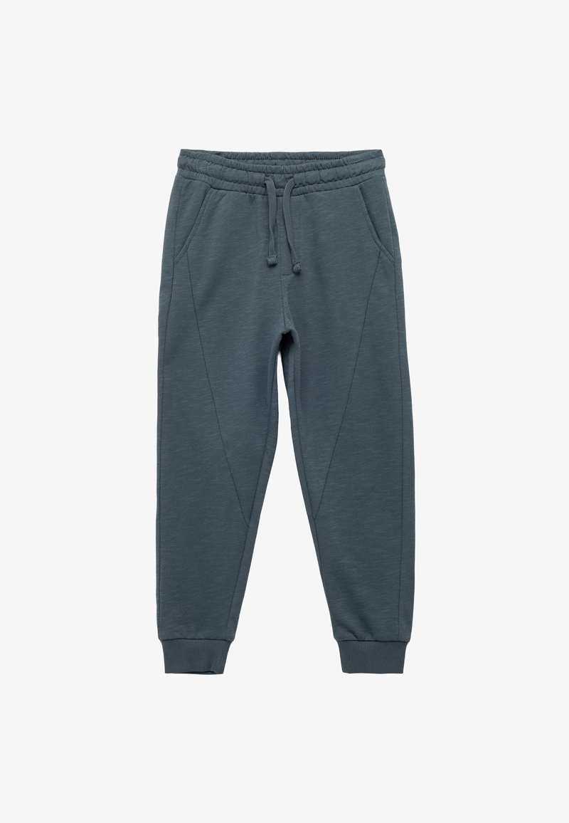 Mörkgrå joggerbyxor tillverkade av mjukt tyg, med elastisk midja, dragsko, sidofickor och avsmalnande muddar med sömnadsdetaljer.