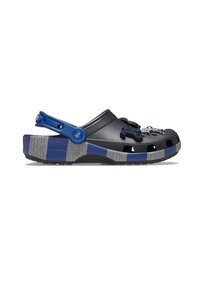 Black crocs with blue accents, textured upper, ventilation holes, and a patterned gray sole. Features decorative charms on the front.