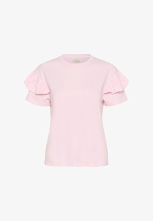 Chemise rose pâle à manches courtes avec encolure ronde et détails de volants sur les manches, sur fond uni.