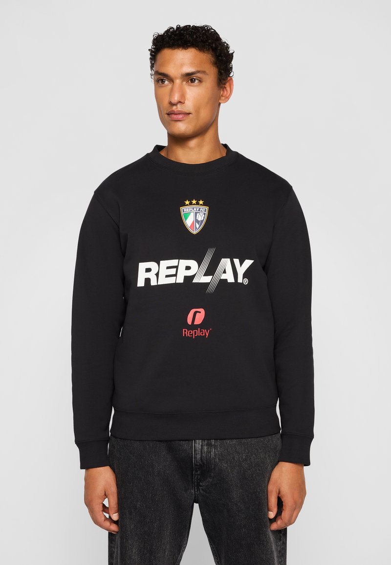 Black sweatshirt, cotton blend, crew neck, featuring a large white "REPLAY" print, logo with stripes, and a badge with three stars.