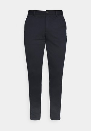 Navy blue chinos made of cotton blend fabric, featuring a straight fit, button closure, belt loops, and front pockets. Smooth texture.