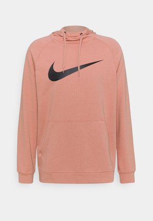 Sweat à capuche rose avec un logo Nike noir, doté d'une capuche à cordon, d'une poche frontale et de poignets et ourlet côtelés. Confectionné en tissu doux.