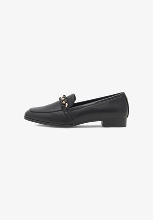 Black leather loafers with a low heel, featuring a decorative gold chain across the vamp and subtle vertical stitching details.