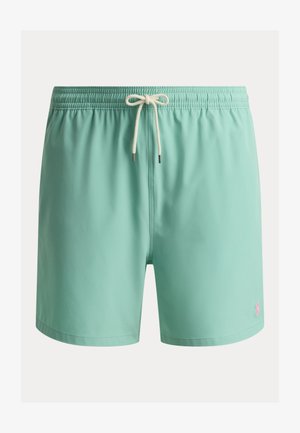 Heledat türkiissinised ujumispüksid elastse vöökohaga, valge paelaga ja väike roosa tikitud logo vasakul säärel.