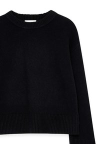 Black knitted sweater with a ribbed crew neckline and hem. Features long sleeves and a relaxed fit, made of a soft, textured material.