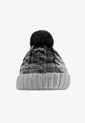 Knitted winter hat with folded ribbed brim, cable knit pattern, and large pom-pom on top, in shades of gray and black.