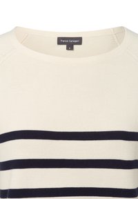 Kremowy sweter z granatowymi poziomymi paskami. Posiada okrągły dekolt i fakturowany materiał dzianinowy. Metka wskazuje rozmiar S.