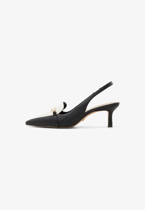 Pump slingback in pelle nera con punta affilata, accentuata in pelle bianca, piccoli dettagli in oro e tacco di 7,5 cm. Texture liscia.