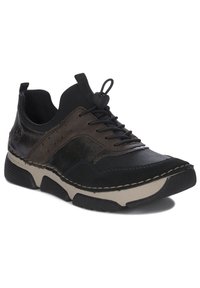 Sneaker neri e marroni con materiali in pelle e tessuto, design con lacci, suola in gomma e cuciture beige a contrasto lungo il bordo.