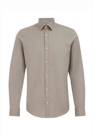 Camicia a maniche lunghe beige chiaro con bottoni, realizzata in cotone morbido. Presenta un colletto classico e polsini con bottone. Design semplice con bottoni frontali.