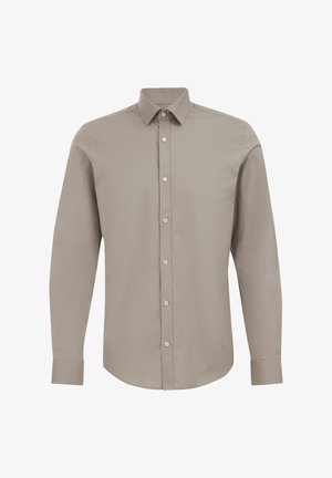Camisa de botones de manga larga de color beige claro, hecha de suave tela de algodón. Cuenta con un cuello clásico y puños abotonados. Diseño limpio con botones frontales.