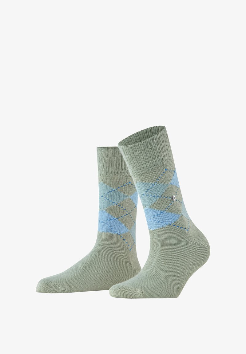 Chaussettes en coton tricoté de couleur vert clair avec un motif argyle bleu et des bords côtes. Texture lisse avec des détails renforcés au niveau des orteils et du talon.
