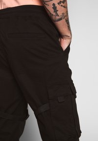 Urban Classics TACTICAL TROUSER - Cargo trousers - black