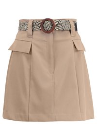 Beige skirt with a textured fabric, featuring a woven black and white belt with a round wooden buckle and two front pockets.