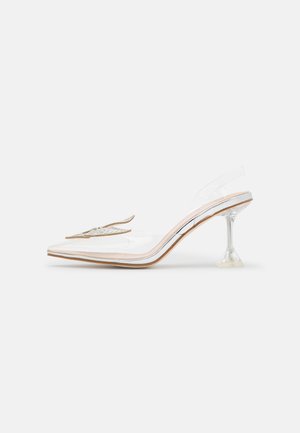 Clear pointed-toe high heel shoe with transparent sides, a unique angular heel, and embellished bow detail on the front.