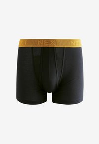Črne bokserice z rumenim elastičnim pasom, ki ima v reliefnem tisku napis "NEXT" in gladko teksturo tkanine.