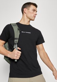 Helly Hansen CORE GRAPHIC - Triko s potiskem - black