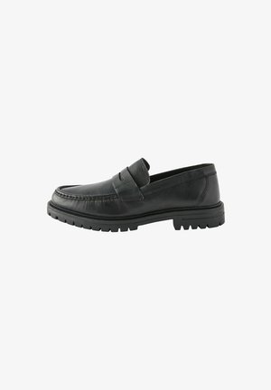 Sort læderloafer med en tekstureret overflade, detaljeret syning og en robust gummisål. Har et slankt design og en bred tåprofil.