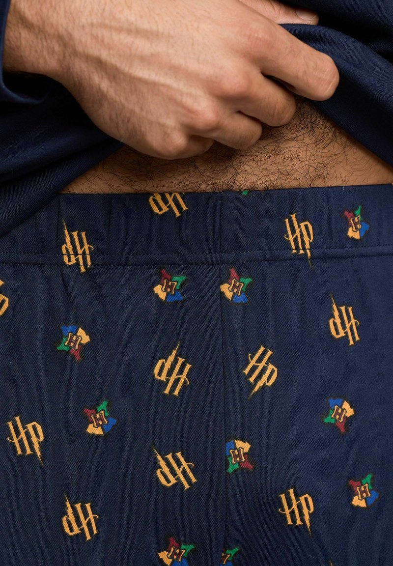Harry Potter Schlafanzug für Herren - Hogwarts Pyjama Set Langarm Oberteil mit Hose Grau/Schwarz