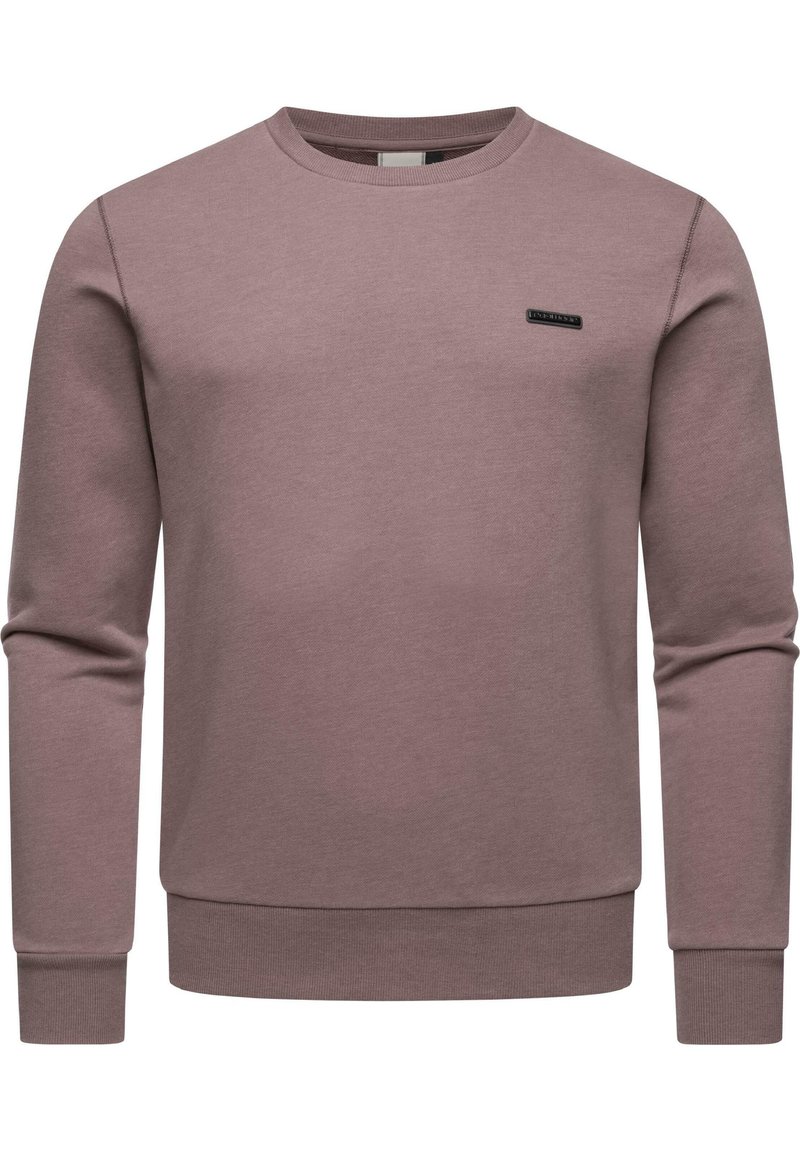 Długi rękaw, bluzka w kolorze mauve, z okrągłym dekoltem, prążkowanymi mankietami i dołem, z małą czarną łatą z logotypem z przodu. Gładka tekstura.