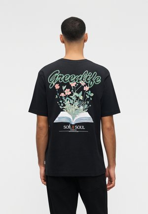 Man facing away wearing black T-shirt with "Greenlife" text and illustration of an open book with flowers and plants growing from its pages.