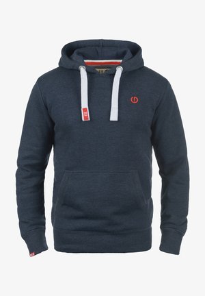 Jūras spēku sudrabpelēka kapuce izgatavota no mīksta auduma, ar priekšējo kabatu, baltām auklām un nelielu sarkanu logotipu uz krūšu. Piedurknes un apakšdaļa ir ribota.