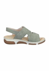 Sandale ouverte vert clair avec côtés découpés, semelle intérieure beige rembourrée, semelle extérieure en caoutchouc texturée blanche et brune, et bride arrière.