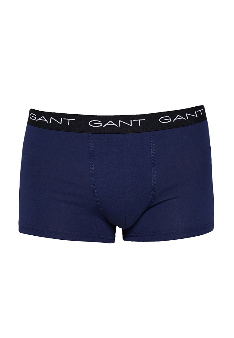 Boxer da uomo blu navy con elastico nero che presenta il logo bianco "GANT" distribuito uniformemente attorno.
