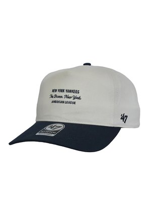 Baseball cap with white crown, navy blue brim, "New York Yankees The Bronx, New York American League" text, and '47 brand logo on side and brim.