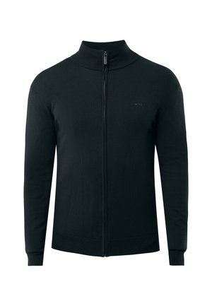 Cárdigan negro con cremallera y cuello alto, con puños acanalados y una textura suave. Marca sutil en la zona del pecho.
