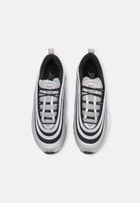 Nike Air Max 97 sneakers, featuring a combination of black, white, and grey mesh and leather, with silver accents and a wavy design.