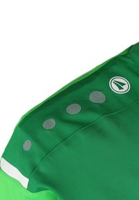 Groen sportshirt met een gladde textuur, voorzien van reflecterende cirkelvormige accenten, een witte streep op de schouder en een logo op de zijkant.