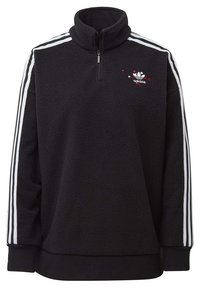 Svart fleece-pullover med hög krage, halvmatchande dragkedja, broderad logotyp och vita ränder längs ärmarna. Mjuk textur, avslappnad design.