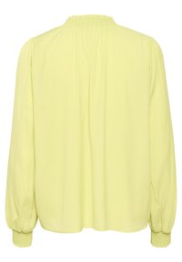 Blusa a maniche lunghe in morbido tessuto giallo, con scollatura arricciata e polsini arricciati, dal taglio rilassato e dalla texture liscia.