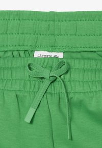 Lacoste Pantaloni sportivi - vert siw