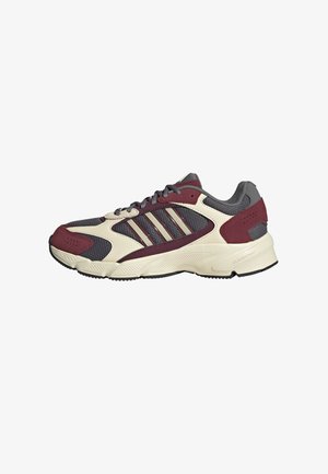 Sneaker con tomaia in rete grigia con accenti bordeaux, sovrapposizioni in un crema chiaro e tre strisce argentate sul lato. Suola testurizzata per una migliore aderenza.