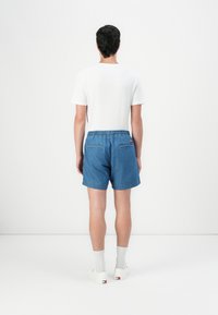 Tommy Jeans BEACH - Denim shorts - dark-blue denim