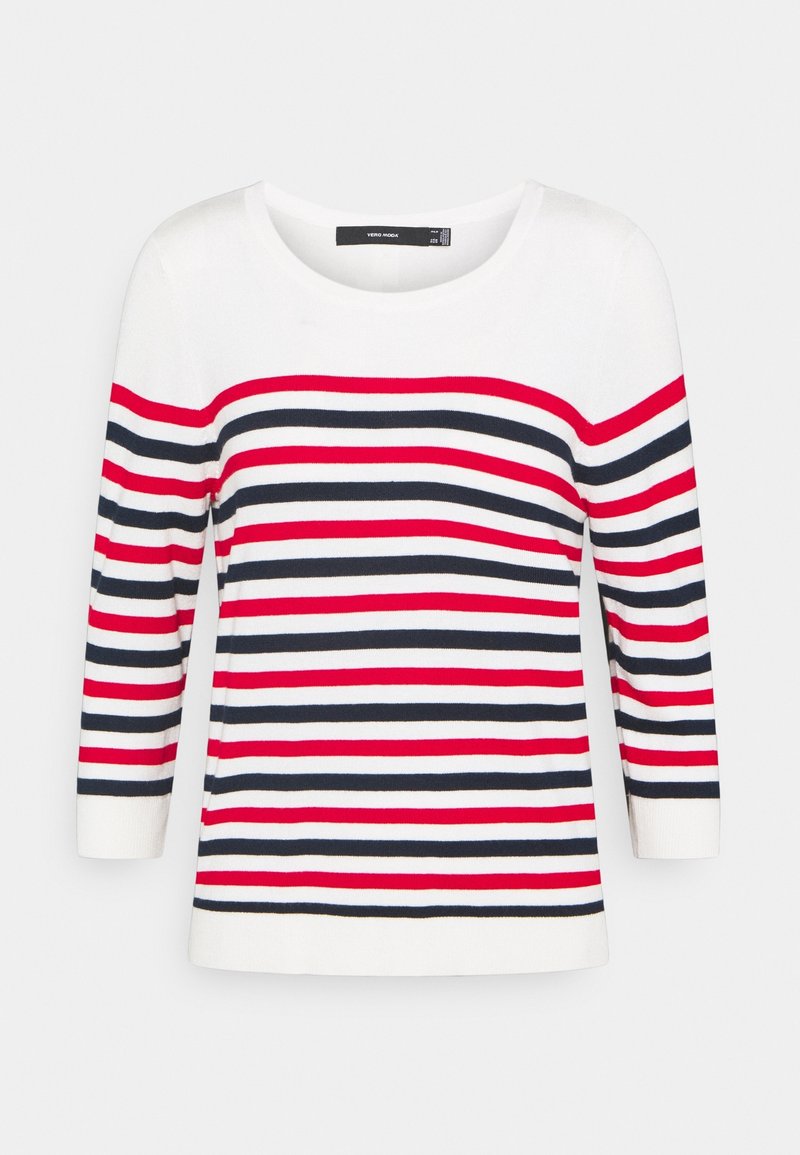 Raidallinen neulepaita, jossa on vaakasuoria raitoja punaisena, laivastonsinisenä ja valkoisena. Pidennetyt hihat, jotka ulottuvat kolme neljännestä, ja pyöreä kaula-aukko. Suuri sileä rakenne.