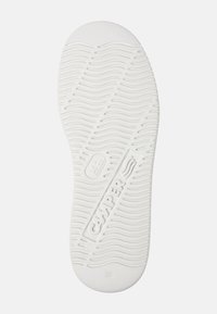 White rubber shoe sole with wavy tread pattern. Features embossed "CAMPER" logo and size "38." Smooth texture, rounded toe design.