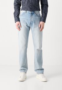 Jeans a gamba dritta blu chiaro, realizzati in denim, con design a cinque tasche e chiusura con zip. Tessuto liscio con leggero sbiadimento.