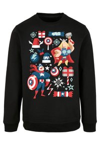 Crna dukserica s karikaturalnim dizajnom superheroja, poklona i blagdanskih simbola u živopisnim bojama. Uzorci uključuju zvijezde, pahulje i svečane motive.