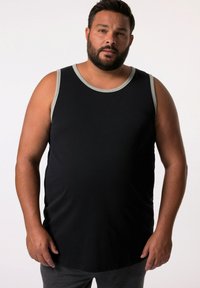 Top nero senza maniche con bordi grigi, caratterizzato da un collo a giro e una vestibilità comoda, realizzato in un materiale morbido e elasticizzato.
