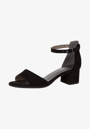 Sandale ouverte en velours noir avec talon carré et bride de cheville ajustable avec boucle en argent.