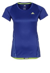 Navy urheilupaita, jossa on lyhyet hihat, pyöreä kaulus ja limevihreät yksityiskohdat. Materiaalin pinta näyttää sileältä ja siinä on sivuilla raidalliset kuviot.