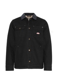 Svart denimjakke med marineblå krage, med to brystlommer og to sidelommer, detaljert med messingbeslag og logopatch.