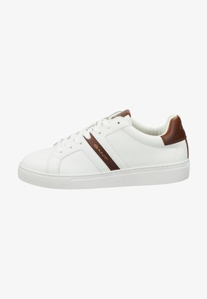 White leather sneakers with brown accents, featuring a low-top design, round toe, and lace-up closure. Textured rubber sole.