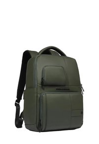 Olive green backpack made of smooth material, featuring multiple zippered pockets, padded straps, and a top handle for easy carrying.