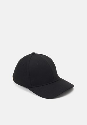 Black baseball cap with curved brim, six-panel construction, and small ventilation eyelets, shown against a plain light background.
