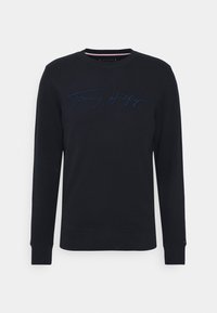 Navyblauwe katoenen sweatshirt met lange mouwen en ronde hals. Heeft een tonale geborduurde logo aan de voorkant en ribgebreide manchetten en zoom.
